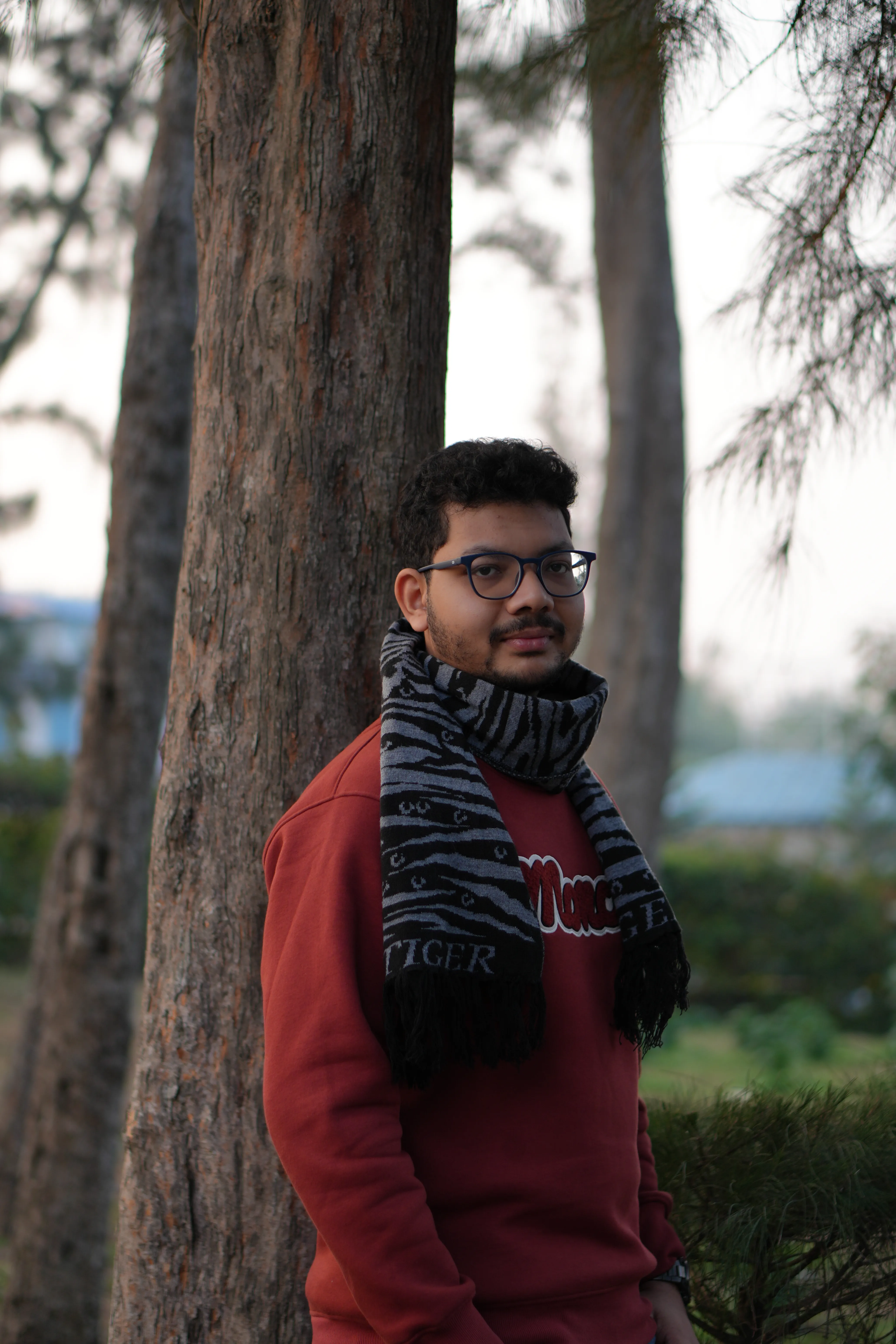 raktim standing beside tree — photograph by Raktim Ranjit
